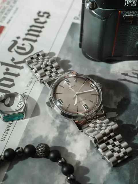 Wristwatch and jewelry arranged for a close-up view