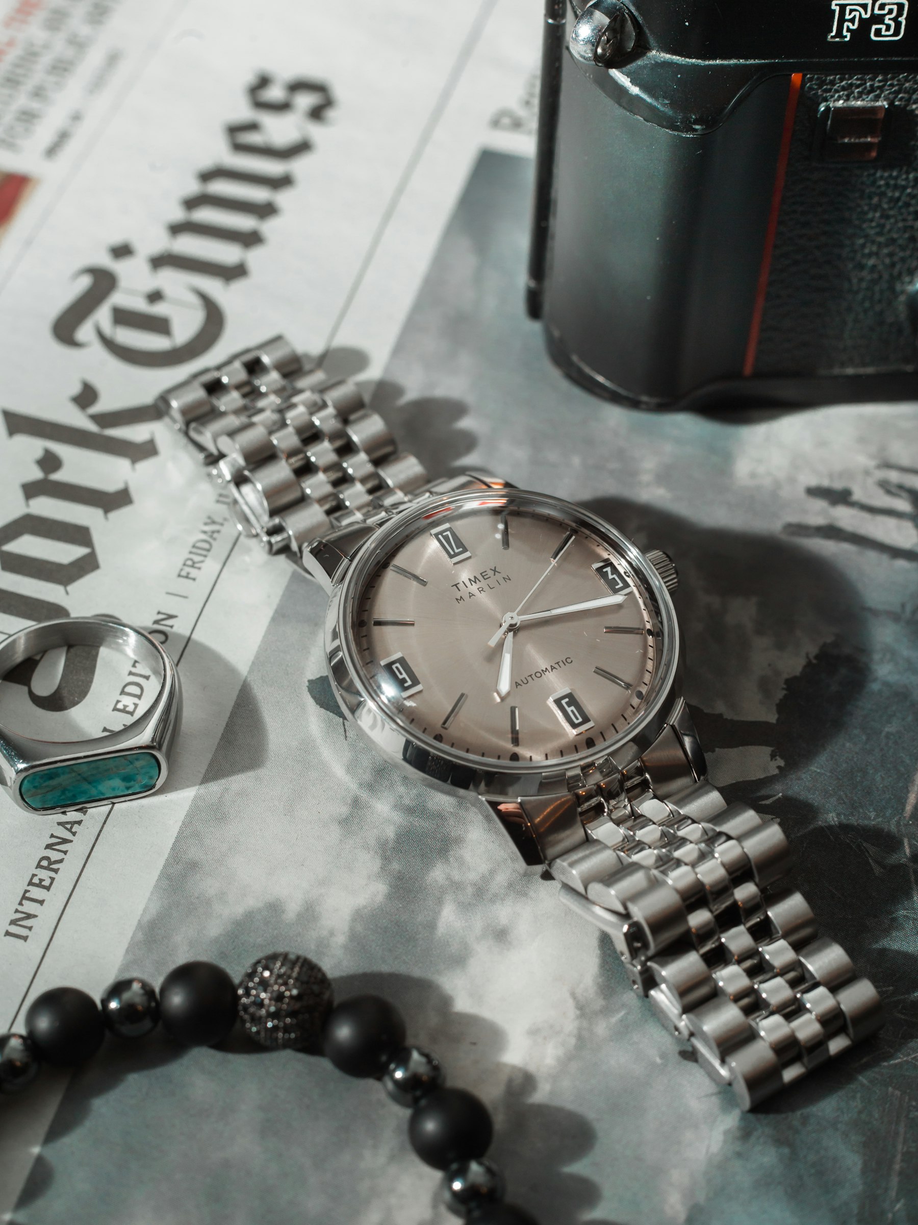 Wristwatch and jewelry arranged for a close-up view